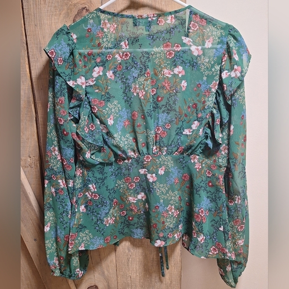 A Lulu's long sleeve sheer button-down floral top with ruffled sleeves in small. - Picture 7 of 7